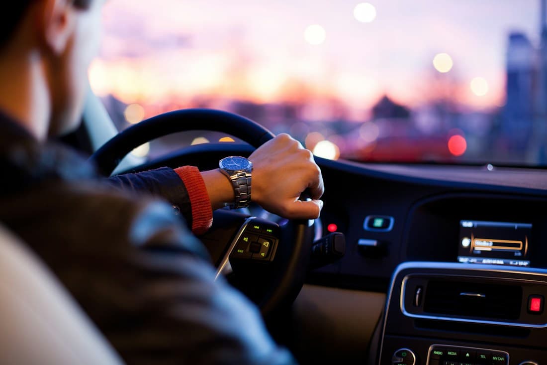 A driver holding the steering wheel — an illustrative practice scene